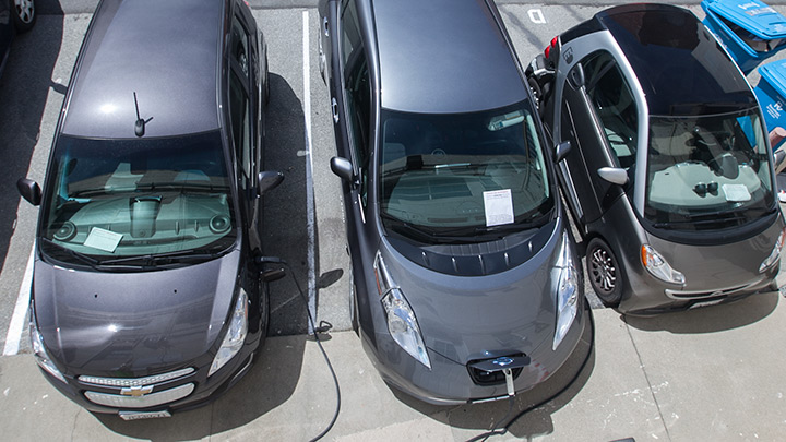 3 electric cars charging.