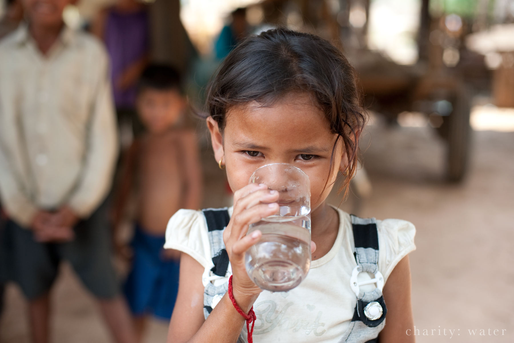 young girl drinkng clean water