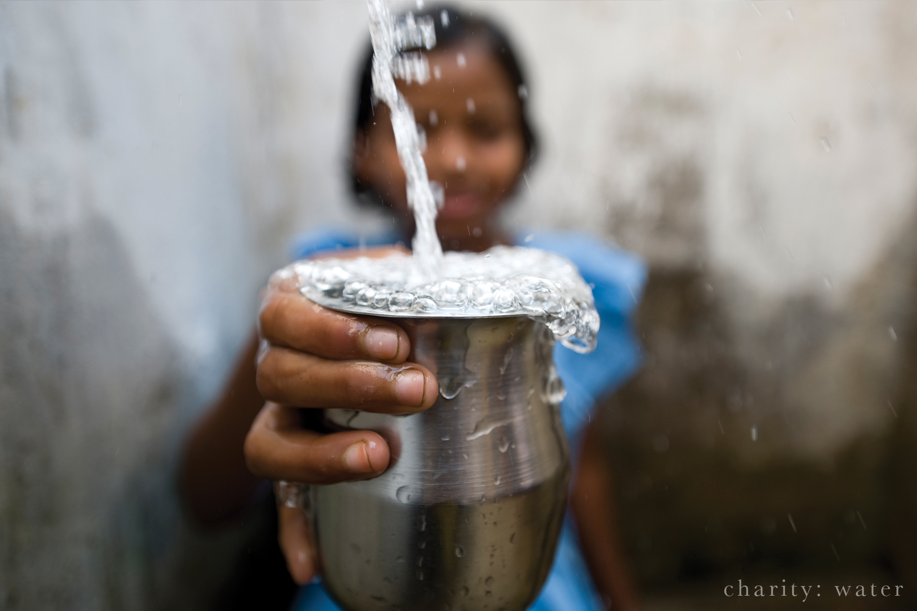 image of a cup filling with water