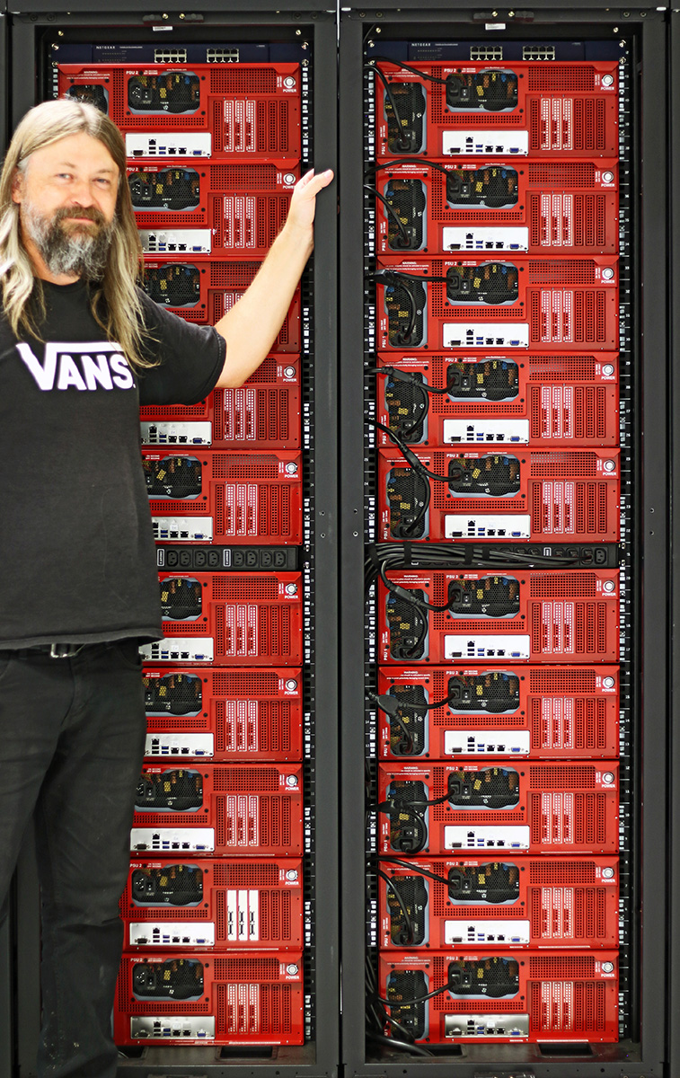 Jon with two Backblaze cabinets, each with 10 Storage Pods, one switch, and one custom PDU