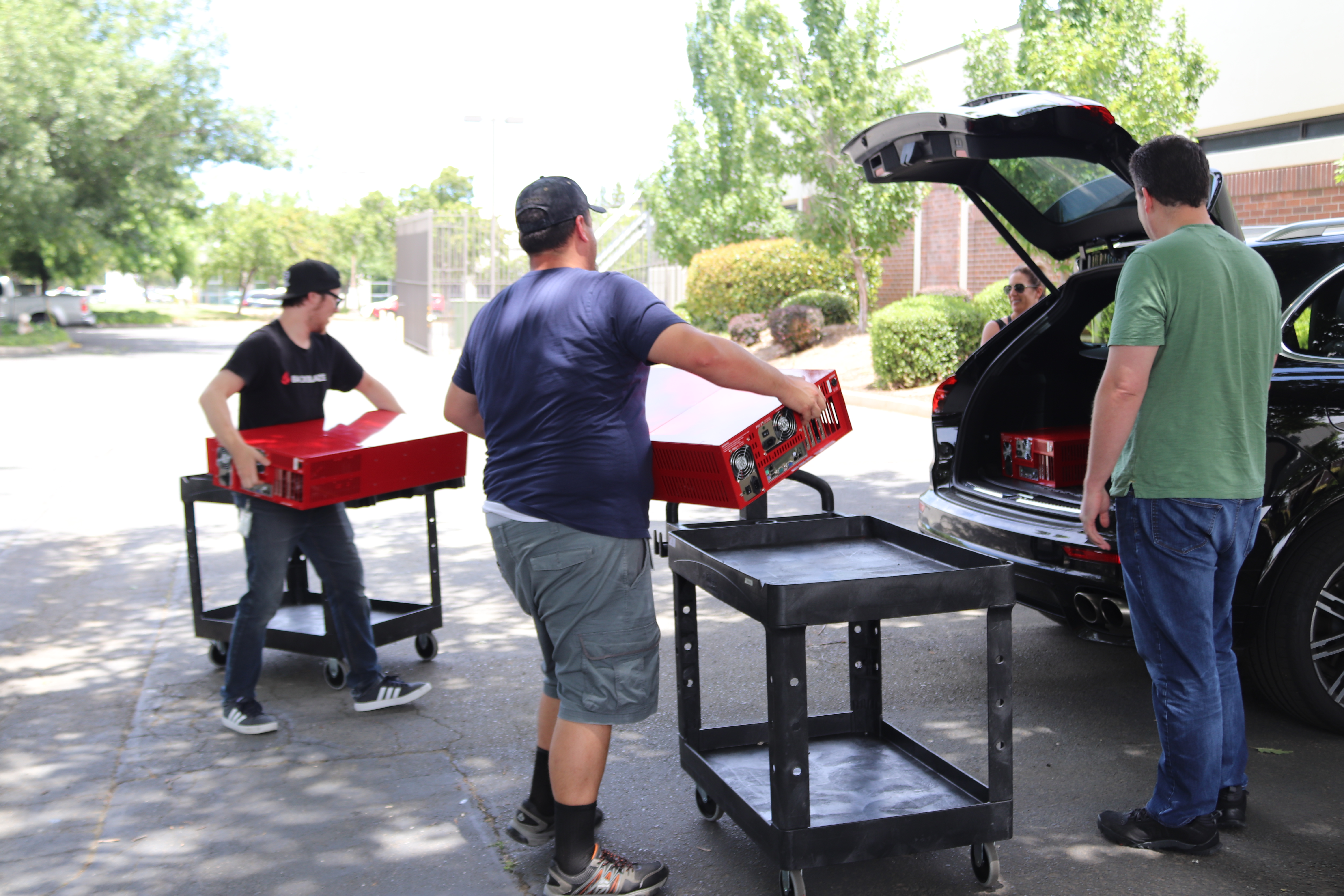 Backblaze techs load storage pods into a car.