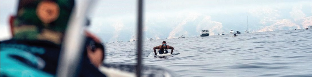 Chris filming on the water during Molokai 2 Oahu Paddleboard World Championships