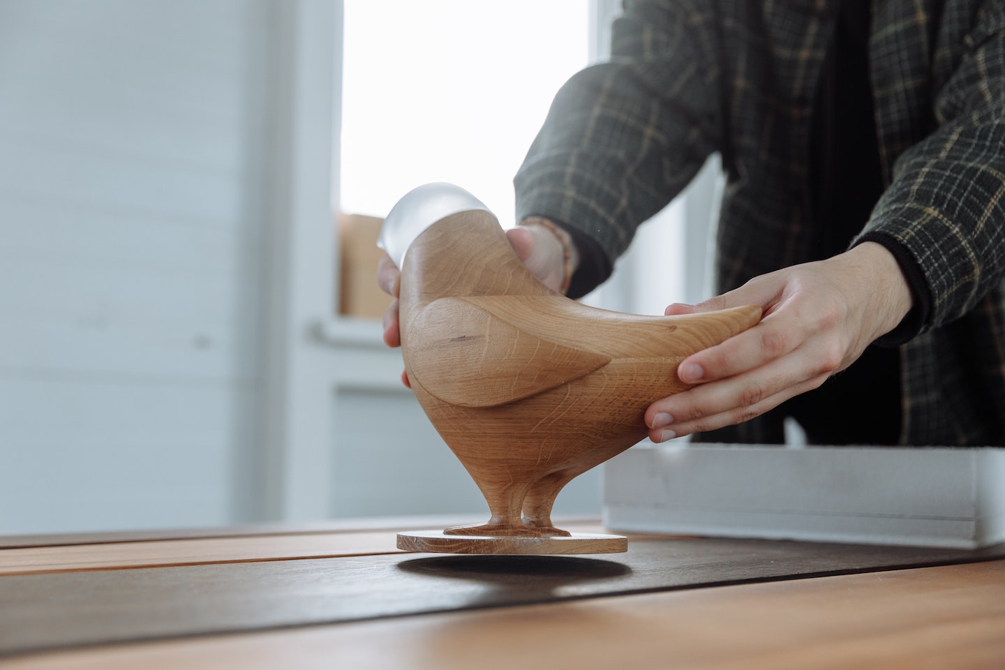 A image of a wooden bird statue. 