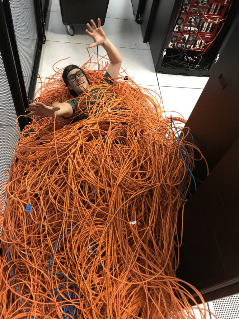 An image of a data center manager with decommissioned cables.