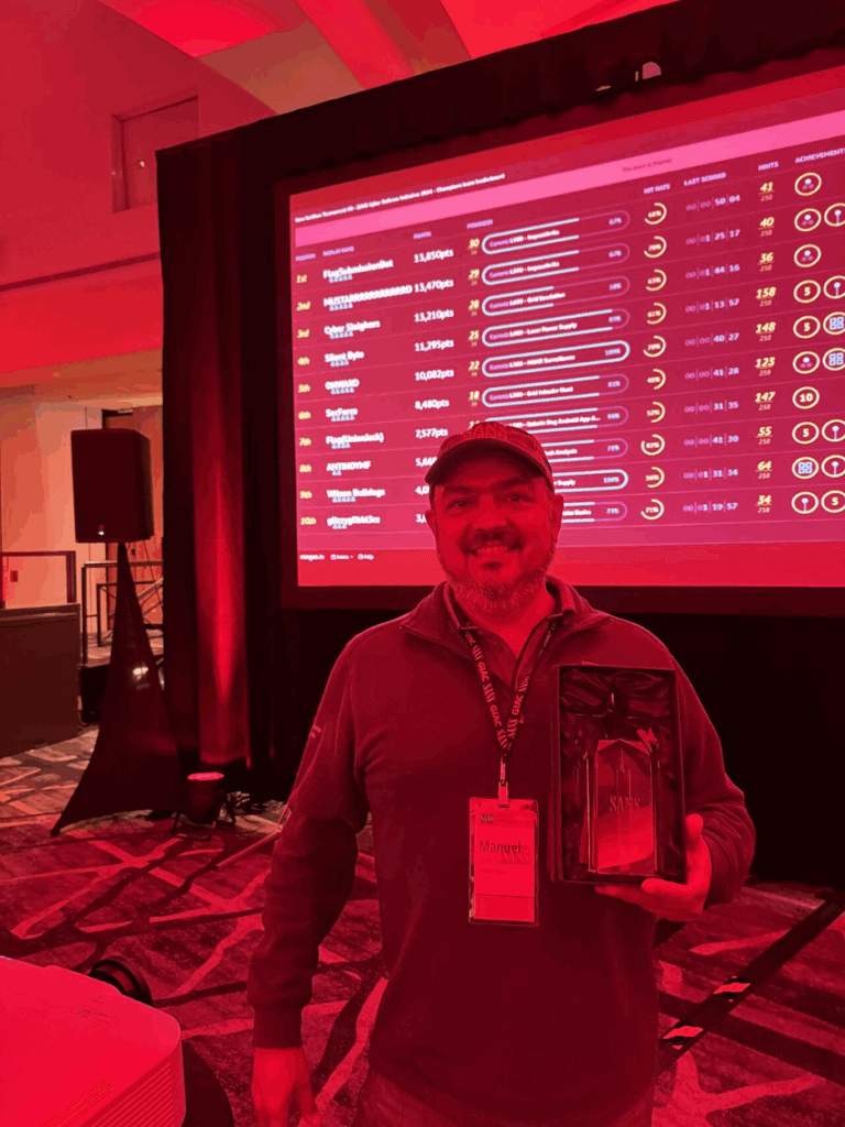 A photo of Manuel Leos Rivas holding his trophy after winning 2024 Sans NetWars.